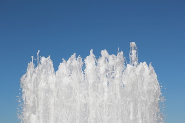 Fountains towards a clear sky