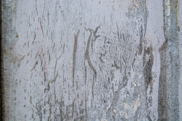 Metal fence covered in paper and glue with interesting texture