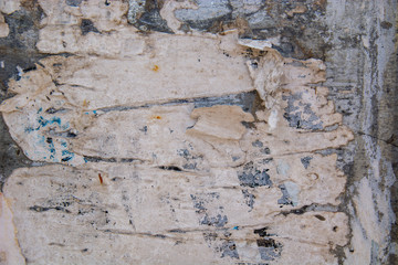Metal fence covered in paper and glue with interesting texture