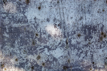 Metal fence covered in paper and glue with interesting texture
