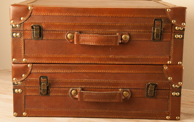 Two Leather Suitcases Stacked One on the Top of Other