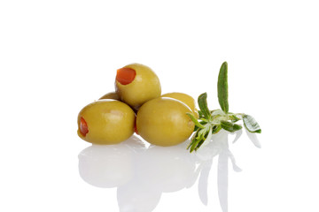 pile of pimento green olives with fresh rosemary herb