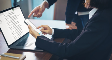 Businesswoman using laptop and smartphone reading email screen connection communication. concept of...