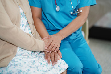 Touching hands Asian senior or elderly old lady woman patient with love, care, helping, encourage and empathy at nursing hospital ward : healthy strong medical concept 