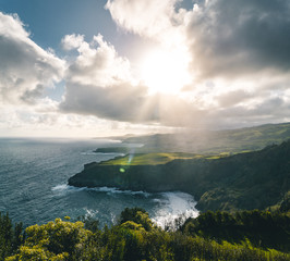 Epic scenic outlook of Miradouro de Santa Iria - north coast of Sao Miguel, largest island of Azores archipelago during sunset with dramatic sky and clouds.