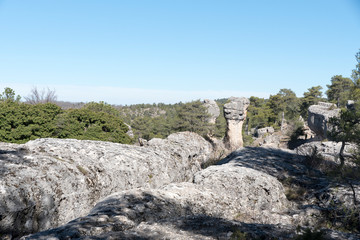 Natural place formed by vegetation and rocks with shapes caused by erosion