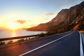 Empty road and sky nature landscape. Picturesque scene and sunrise above road