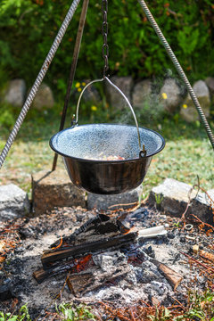 Hungarian pot over the fire bogracs during cooking the dish.
