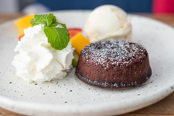 Chocolate Lava Cake with fresh fruits, icecream and whipcream.