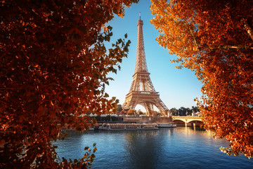 Fototapeta na wymiar Seine in Paris with Eiffel tower in autumn time