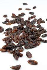  Dried raisins isolated on a white background.