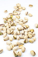  Pistachio nuts isolated on a white background.