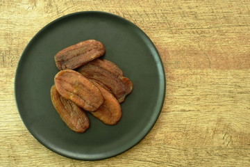 dry golden banana slice with honey Thai preserved food on dish