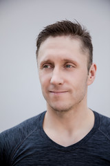 Fototapeta premium Sporty man in gray t-shirt portrait