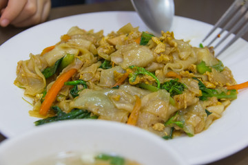 Fried noodle soy sauce on white dish