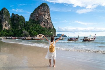 Young woman traveler enjoying a summer vacation at tropical sand beach in Krabi, Thailand © Kittiphan