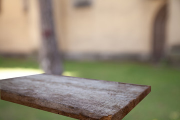 wooden empty table on the background of a blurred forest garden park