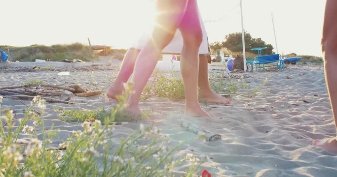 Group of friends spending time on the beach and making party. Having fun on a lonely tropical island