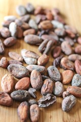 cocoa beans on a wooden surfaceb ingredient for vegetarian food