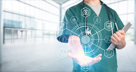 young doctor with hospital background