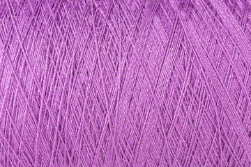 background of purple wool on a cone