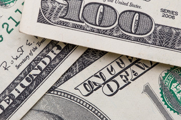 Texture of dollar bills. One hundred dollars. Close-up, macro.