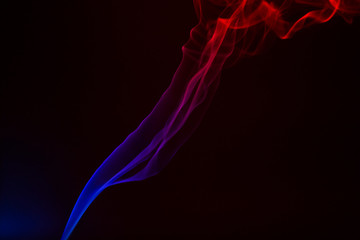 Colorful smoke close-up on a black background
