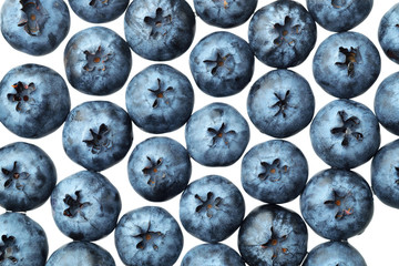 Fresh selected blueberries isolated on white background. Top view pattern