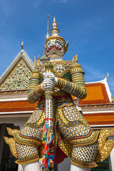Fototapeta premium Bangkok, Thailand at Wat Arun Temple, Giant Statue guarding the entrance to the temple, Bangkok, Thailand. on the Thonburi west bank of the Chao Phraya River.