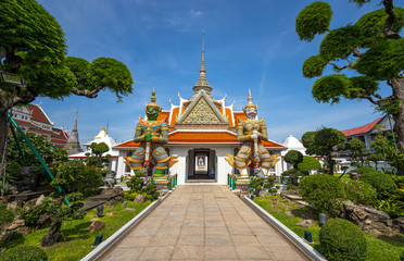 Naklejka premium Bangkok, Thailand at Wat Arun Temple, Giant Statue guarding the entrance to the temple, Bangkok, Thailand. on the Thonburi west bank of the Chao Phraya River.