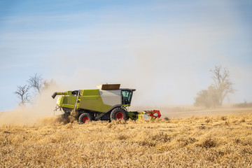 Combine harvester at agricultural field