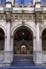 Obraz premium Heraklion, Crete Island / Greece. The entrance at the facade of the Venetian Loggia building in the center of Heraklion city. Lions Square