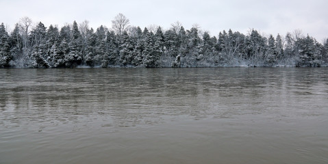 The Grand River tree line covered in fresh snow fall. Shot during early spring in Kitchener,...