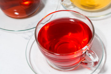 assortment of tea in glass cups, top view closeup