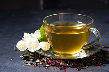 cup of fragrant jasmine tea on a dark table