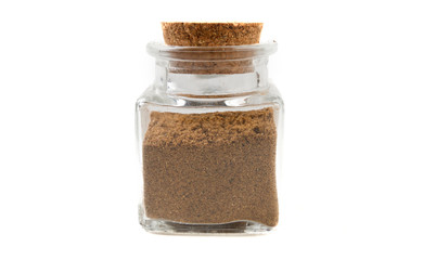 garam masala mix in glass  jar on isolated on white background. front view. spices and food ingredients.
