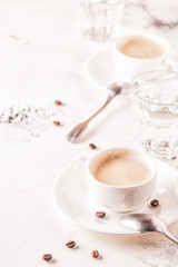 Traditional breakfast with fresh croissants on white background.