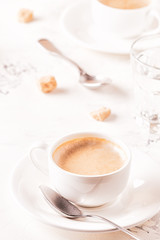 Traditional breakfast with fresh croissants on white background.