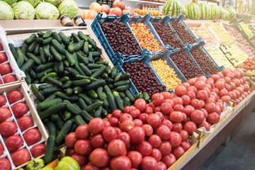 Vegetable farmer market counter: colorful various fresh organic healthy vegetables at grocery store. Healthy natural food concept