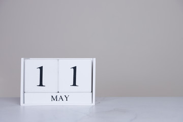 May Date Cube White Background