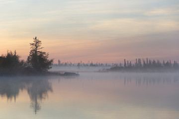 Fototapeta na wymiar Dawn mist over lake