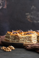 Baklava. Ramadan Dessert. Traditional Arabic dessert with walnuts and honey on a wooden table. 