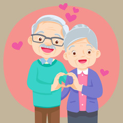 Elderly couple holding hands  make shape of heart