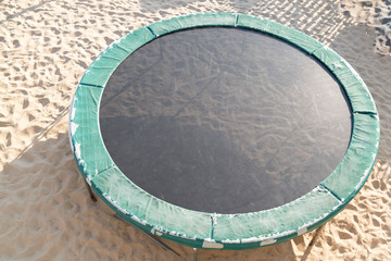 trampoline on the sand seen from above in top view outdoors