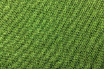 textile green color rough weaving thread texture close-up