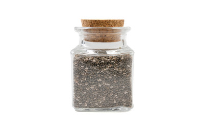 chia seeds in glass  jar on isolated on white background. front view. spices and food ingredients.