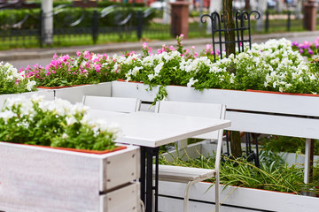Empty outdoor cafe terrace in the city street