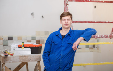 professional builder makes repairs in the apartment