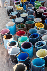 A variety of colored paint cans
