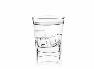 Glass with ice water on a white background